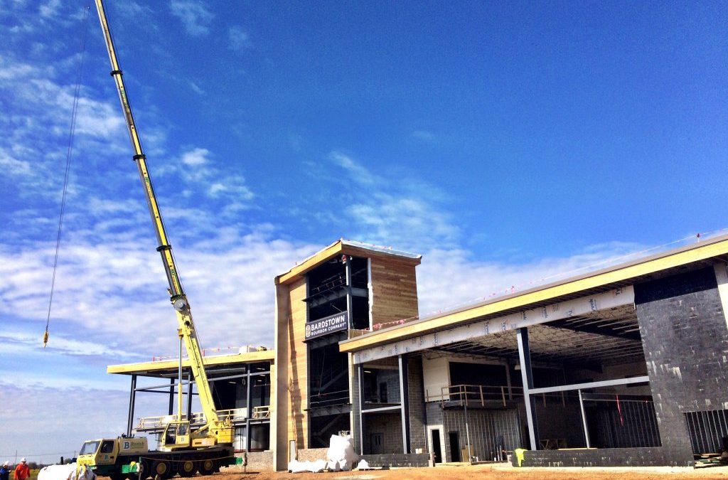 Grove All Terrain crane installs 50-foot tall 36-inch stainless steel Vendome Copper & Brass Works still