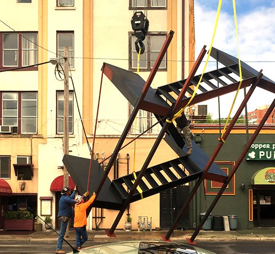 Tanner’s Crane Service of Malvern Arkansas maneuver a fire escape