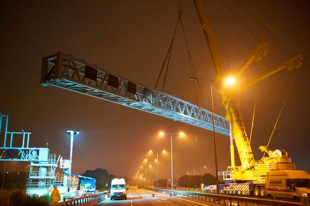 Ainscough Crane Hire’s 500-ton All Terrain Crane setting superspan gantries on M62 in UK.