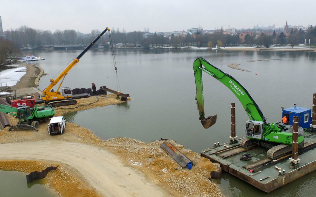 Telescopic crane and material handler place sheet pile walls in hydraulic engineering for DOMARIN