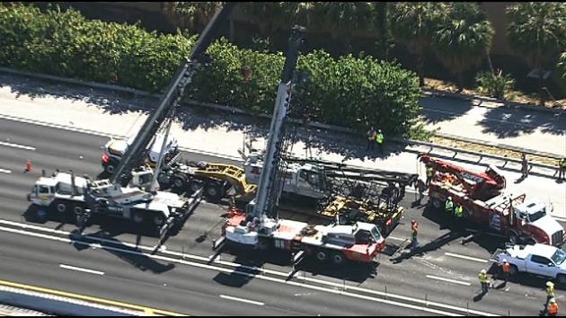 Two Link-Belt cranes called in to right a crawler crane that fell off low boy trailer.