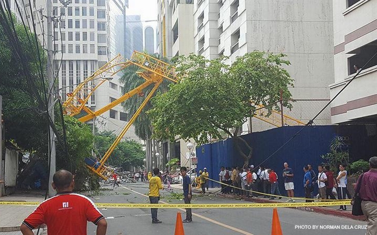 Two hurt as tower crane collapses on busy Makati street in the Philippines