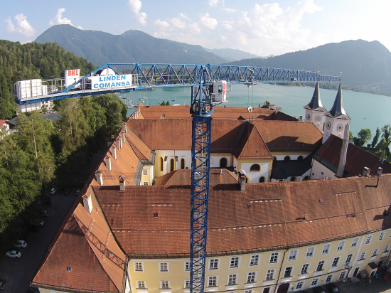 Two Linden Comansa cranes at the Tegernsee lake, Germany