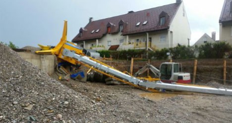 Catastrophic weather topples crane in Austria