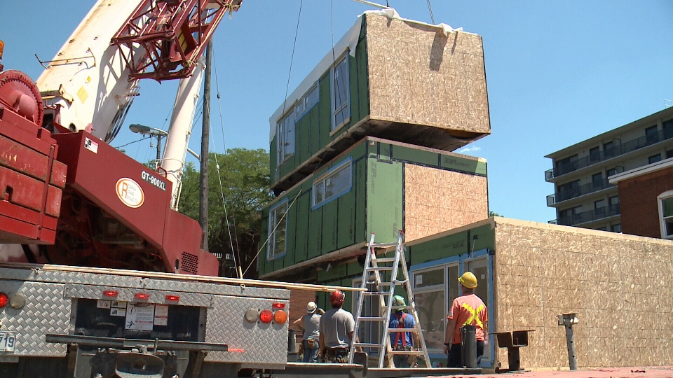 Regional Crane Rentals Ltd. Tadano GT-900XL sets three ready made homes in Ottawa
