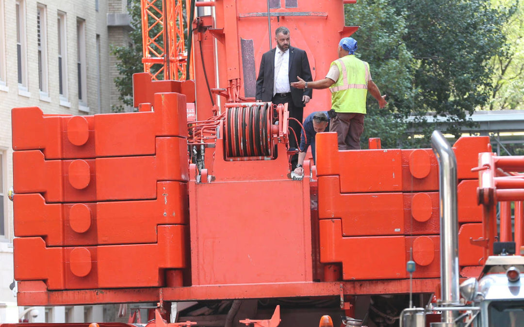 On Labor Day a Worker dies while breaking down a Mobile All Terrain Crane is Boston