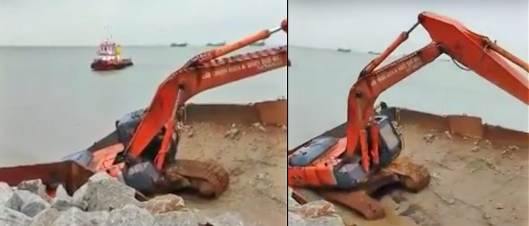 Dramatic Footage of Excavator overtuning with Operator on barge in rough seas in Malaysia