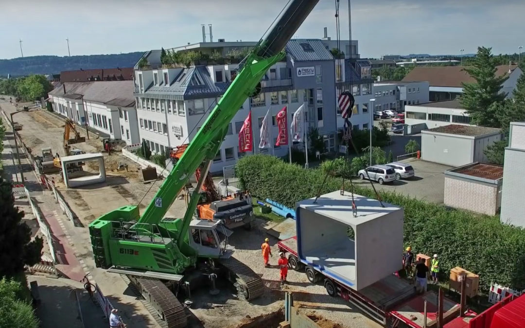 The SENNEBOGEN 6113 E Telescopic Crawler Crane working on a storm water reservoir in Germany