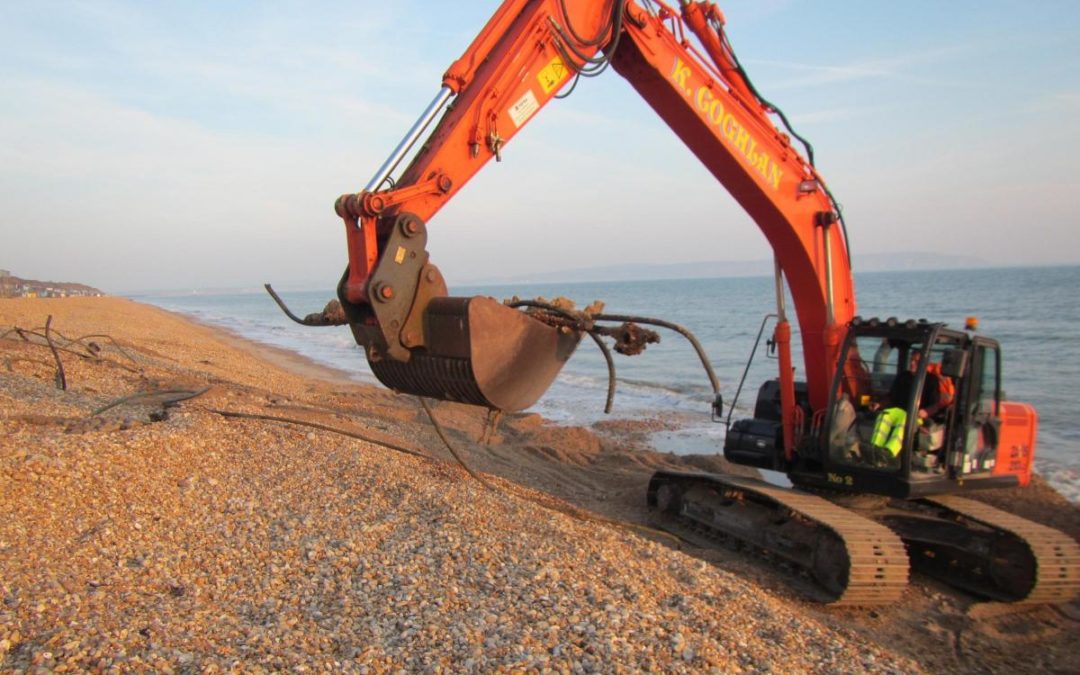 K Coghlan Plant & Transport Ltd uses Hitachi excavators to remove WW II anti-invasion barriers from southern England beachheads