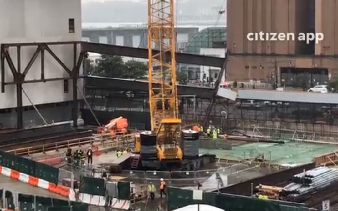 Beams dangling from crane at construction site near Javits Center in NY City